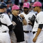  Chicago White Sox pitching coach Don Cooper, second from left, talks to starter Jose Quintana, right, as catcher Tyler Flowers, left, and shortstop Alexei Ramirez listen during the fifth inning of an interleague baseball game against the Arizona Diamondbacks in Chicago, Saturday, May 10, 2014. (AP Photo/Nam Y. Huh)