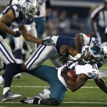 Philadelphia Eagles wide receiver Jeremy Maclin (18) is tackled by Dallas Cowboys' Rolando McClain, rear, after grabbing a pass during the first half of an NFL football game, Thursday, Nov. 27, 2014, in Arlington, Texas. Cowboys' Orlando Scandrick, left, assists on the play. (AP Photo/John F. Rhodes)