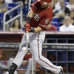 Arizona Diamondbacks' David Peralta connects for a single in the first inning during a baseball game against the Miami Marlins, Sunday, Aug. 17, 2014, in Miami. (AP Photo/Lynne Sladky)