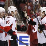 Ottawa Senators' Clarke MacArthur (16) celebrates his goal against the Arizona Coyotes with teammates Kyle Turris (7) and Erik Karlsson (65), of Sweden, during the first period of an NHL hockey game Saturday, Jan. 10, 2015, in Glendale, Ariz. (AP Photo/Ross D. Franklin)