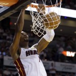 Miami Heat center Chris Bosh dunks against the San Antonio Spurs in the first half in Game 3 of the NBA basketball finals, Tuesday, June 10, 2014, in Miami. (AP Photo/Wilfredo Lee)