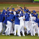 The Kansas City Royals players celebrate after the Royals defeated the Baltimore Orioles 2-1 in Game 4 of the American League baseball championship series Wednesday, Oct. 15, 2014, in Kansas City, Mo. The Royals advance to the World Series. (AP Photo/Michael Conroy)