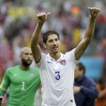 United States' Omar Gonzalez celebrates after qualifying for the next World Cup round following their 1-0 loss to Germany during the group G World Cup soccer match between the USA and Germany at the Arena Pernambuco in Recife, Brazil, Thursday, June 26, 2014. (AP Photo/Ricardo Mazalan)