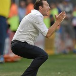 Belgium's head coach Marc Wilmots reacts during the World Cup quarterfinal soccer match between Argentina and Belgium at the Estadio Nacional in Brasilia, Brazil, Saturday, July 5, 2014. (AP Photo/Martin Meissner)