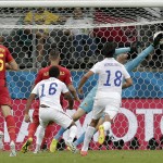 Belgium's goalkeeper Thibaut Courtois can not stop a shot by United States' Julian Green (16) as Green scores his side's first goal in extra time during the World Cup round of 16 soccer match between Belgium and the USA at the Arena Fonte Nova in Salvador, Brazil, Tuesday, July 1, 2014. (AP Photo/Marcio Jose Sanchez)