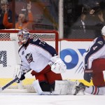 Columbus Blue Jackets' Sergei Bobrovsky (72), of Russia, and Kevin Connauton (4) look around for the puck after Arizona Coyotes' Tobias Rieder, of Germany, scores a goal during the first period of an NHL hockey game Saturday, Jan. 3, 2015, in Glendale, Ariz. (AP Photo/Ross D. Franklin)