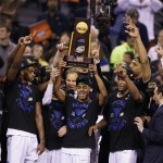 Duke players celebrate with the trophy after their 68-63 victory over Wisconsin in the NCAA Final Four college basketball tournament championship game Monday, April 6, 2015, in Indianapolis. (AP Photo/Darron Cummings)