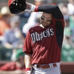 Arizona Diamondbacks' Cody Ross wipes his brow while waiting to bat against the San Francisco Giants in the third inning of a spring training exhibition baseball game Tuesday, March 17, 2015, in Scottsdale, Ariz. (AP Photo/Ben Margot)