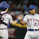 New York Mets pitcher Jeurys Familia (27) and catcher Kevin Plawecki celebrate after defeating the Arizona Diamondbacks 6-3 in a baseball game, Sunday, June 7, 2015, in Phoenix. (AP Photo/Rick Scuteri)