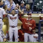 Arizona Diamondbacks' Nick Ahmed (13) is congratulated after hitting a home run during the eighth inning of a baseball game against the Milwaukee Brewers on Friday, May 29, 2015, in Milwaukee. (AP Photo/Morry Gash)