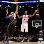 World Team's Giannis Antetokounmpo, left, of the Milwaukee Bucks, reaches for the ball in front of U.S.Team's Kentavious Caldwell-Pope, of the Detroit Pistons, during the first half of the Rising Stars NBA All Star Challenge, Friday, Feb. 13, 2015, in New York. (AP Photo/Julio Cortez)