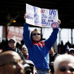 Jake Schrum, 10, of Cedar Lake, Ind., holds a sign during the fifth inning of a baseball game between the Chicago Cubs and the Arizona Diamondbacks at Wrigley Field in Chicago on Wednesday, April 23, 2014. (AP Photo/Andrew A. Nelles)