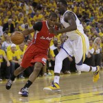  Los Angeles Clippers guard Chris Paul, left, drives to the basket against Golden State Warriors small forward Draymond Green during the first quarter of Game 6 of an opening-round NBA basketball playoff series in Oakland, Calif., Thursday, May 1, 2014. (AP Photo/Marcio Jose Sanchez)