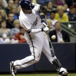  Milwaukee Brewers' Carlos Gomez hits a two-run single during the sixth inning of a baseball game against the Arizona Diamondbacks Monday, May 5, 2014, in Milwaukee. (AP Photo/Morry Gash)