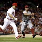 Arizona Diamondbacks relief pitcher Randall Delgado, right, throws St. Louis Cardinals' Mark Ellis,left, out at first during the eighth inning of a baseball game Thursday, May 22, 2014, in St. Louis. (AP Photo/Jeff Roberson)
