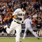 San Francisco Giants' Brandon Crawford hits an RBI single during the fourth inning of Game 5 of baseball's World Series against the Kansas City Royals Sunday, Oct. 26, 2014, in San Francisco. (AP Photo/David J. Phillip)