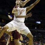  Texas' Demarcus Holland (2) drives to the basket against Arizona State's Jordan Bachynski during the second half of a second-round game in the NCAA college basketball tournament Thursday, March 20, 2014, in Milwaukee. (AP Photo/Morry Gash)