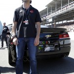 Pace car driver and three-time Indy 500 champion Dario Franchitti, of Scotland, stands next to the pace car during the playing of the National Anthem before the start of the 98th running of the Indianapolis 500 IndyCar auto race at the Indianapolis Motor Speedway in Indianapolis, Sunday, May 25, 2014. (AP Photo/R Brent Smith)