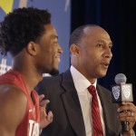 Stanford head coach Johnny Dawkins, right, speaks next to guard Chasson Randle during NCAA college basketball Pac-12 media day in San Francisco, Thursday, Oct. 23, 2014. (AP Photo/Jeff Chiu)