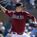 Arizona Diamondbacks starting pitcher Trevor Cahill throws to the Milwaukee Brewers during the first inning of a spring exhibition baseball game in Scottsdale, Ariz., Sunday, March 16, 2014. (AP Photo/Chris Carlson)