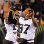  Cleveland Browns inside linebacker Craig Robertson (53) celebrates with Jabaal Sheard (97) after Robertson intercepted a pass during the first half of an NFL football game against the Cincinnati Bengals on Thursday, Nov. 6, 2014, in Cincinnati. (AP Photo/Darron Cummings)