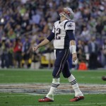 New England Patriots quarterback Tom Brady (12) reacts after his pass was blocked by Seattle Seahawks defensive tackle Tony McDaniel (99) during the first half of NFL Super Bowl XLIX football game Sunday, Feb. 1, 2015, in Glendale, Ariz. (AP Photo/Mark Humphrey)