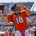 Denver Broncos quarterback Peyton Manning (18) warms up prior to an NFL football game against the Arizona Cardinals, Sunday, Oct. 5, 2014, in Denver. (AP Photo/Jack Dempsey)