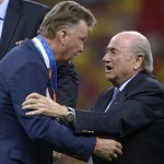  FIFA President Sepp Blatter, right, presents Netherlands' head coach Louis van Gaal with his 3rd place medal after the World Cup third-place soccer match between Brazil and the Netherlands at the Estadio Nacional in Brasilia, Brazil, Saturday, July 12, 2014. The Netherlands won the match 3-0. (AP Photo/Manu Fernandez)