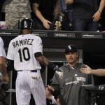  Chicago White Sox's Alexei Ramirez (10) celebrates with manager Robin Ventura right, in the dugout after hitting a grand slam during the fourth inning of a baseball game against the Arizona Diamondbacks in Chicago, Friday, May 9, 2014. (AP Photo/Paul Beaty)