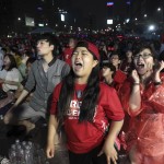  South Korean soccer fans react after Algeria scored the third goal against South Korea during their group H World Cup soccer match at a public viewing venue in Seoul, South Korea, Monday, June 23, 2014. (AP Photo/Ahn Young-joon)