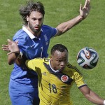 Greece's Giorgos Samaras, left, fights for the ball with Colombia's Juan Zuniga during the group C World Cup soccer match between Colombia and Greece at the Mineirao Stadium in Belo Horizonte, Brazil, Saturday, June 14, 2014. (AP Photo/Andrew Medichini)