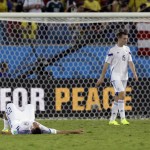  Bosnia's Sejad Salihovic, left, lies on the pitch as teammate Toni Sunjic walks off after Nigeria's 1-0 victory over Bosnia during the group F World Cup soccer match at the Arena Pantanal in Cuiaba, Brazil, Saturday, June 21, 2014. (AP Photo/Thanassis Stavrakis)