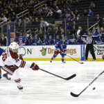 Arizona Coyotes' Mark Arcobello (36) shoots past New York Rangers' Kevin Klein to score a goal during the first period of an NHL hockey game Thursday, Feb. 26, 2015, in New York. (AP Photo/Frank Franklin II)