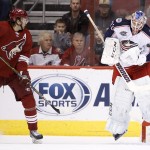 Columbus Blue Jackets' Sergei Bobrovsky (72), of Russia, makes a jumping save on a shot at Arizona Coyotes' Martin Hanzal (11), of the Czech Republic, during the first period of an NHL hockey game Saturday, Jan. 3, 2015, in Glendale, Ariz. (AP Photo/Ross D. Franklin)