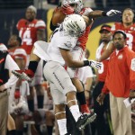 Ohio State's Jalin Marshall catches a pass with Oregon's Erick Dargan (4) defending during the first half of the NCAA college football playoff championship game Monday, Jan. 12, 2015, in Arlington, Texas. (AP Photo/Brandon Wade)