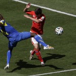 Ecuador's Juan Paredes, left, and Switzerland's Valentin Stocker challenge for the ball during the group E World Cup soccer match between Switzerland and Ecuador at the Estadio Nacional in Brasilia, Brazil, Sunday, June 15, 2014. (AP Photo/Themba Hadebe)