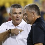 Arizona State head coach Todd Graham, left, talks with Utah head coach Kyle Wittingham prior to an NCAA college football game on Saturday, Nov. 1, 2014, in Tempe, Ariz. (Photo/Ross D. Franklin)