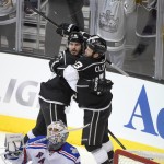 Los Angeles Kings defenseman Drew Doughty, left, celebrates his goal past New York Rangers goalie Henrik Lundqvist, of Sweden, with left wing Kyle Clifford during the second period of Game 1 in the NHL Stanley Cup Final hockey series against the New York Rangers on Wednesday, June 4, 2014, in Los Angeles.(AP Photo/Mark J. Terrill)