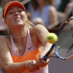 Russia's Maria Sharapova returns the ball to Romania's Simona Halep during their final match of the French Open tennis tournament at the Roland Garros stadium, in Paris, France, Saturday, June 7, 2014. (AP Photo/Michel Euler)