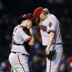 Arizona Diamondbacks starting pitcher Bronson Arroyo, right, and catcher Miguel Montero meet on the mound during the sixth inning of a baseball game against the Chicago Cubs on Monday, April 21, 2014, in Chicago. (AP Photo/Andrew A. Nelles)