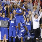 Kentucky forward Alex Poythress (22) reacts after a three-point basket during the second half of an NCAA Final Four tournament college basketball semifinal game against Wisconsin Saturday, April 5, 2014, in Arlington, Texas. Kentucky won 74-73. (AP Photo/Tony Gutierrez)