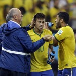 Brazil's Neymar is congratulated by Brazil's coach Luiz Felipe Scolari after Neymar scored during the group A World Cup soccer match between Brazil and Croatia, the opening game of the tournament, in the Itaquerao Stadium in Sao Paulo, Brazil, Thursday, June 12, 2014. (AP Photo/Kirsty Wigglesworth)