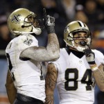New Orleans Saints wide receiver Marques Colston (12) celebrates a touchdown with wide receiver Kenny Stills (84) during the first half of an NFL football game Monday, Dec. 15, 2014, in Chicago. (AP Photo/Nam Y. Huh)