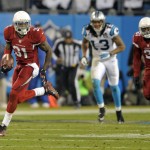 Arizona Cardinals' Antonio Cromartie (31) returns an interception against the Carolina Panthers in the first half of an NFL wild card playoff football game in Charlotte, N.C., Saturday, Jan. 3, 2015. (AP Photo/Mike McCarn)
