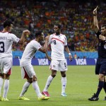 Costa Rica's Giancarlo Gonzalez (3) signals to feferee Ravshan Irmatov from Uzbekistan while being given a yellow card during the World Cup quarterfinal soccer match between the Netherlands and Costa Rica at the Arena Fonte Nova in Salvador, Brazil, Saturday, July 5, 2014. (AP Photo/Natacha Pisarenko)