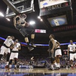 Purdue center Isaac Haas dunks during the first half of an NCAA tournament second round college basketball game against Cincinnati in Louisville, Ky., Thursday, March 19, 2015. (AP Photo/David Stephenson)