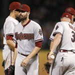 Arizona Diamondbacks' Robbie Ray, walks off the mound after handing the ball over to manager Chip Hale (3) during the eighth inning of an interleague baseball game against the Texas Rangers on Tuesday, July 7, 2015, in Arlington, Texas. The Diamondbacks won 4-2. (AP Photo/Tony Gutierrez)