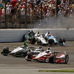 Ed Carpenter (20) and James Hinchcliffe, (27) of Canada, crash in the first turn during the 98th running of the Indianapolis 500 IndyCar auto race at the Indianapolis Motor Speedway in Indianapolis, Sunday, May 25, 2014. (AP Photo/Steve Metz)