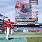 Philadelphia Phillies' Chase Utley throws the ball around during warm-ups prior to the first inning of an opening day baseball game against the Boston Red Sox, Monday, April 6, 2015, in Philadelphia. (AP Photo/Chris Szagola)