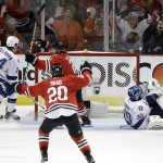Chicago Blackhawks' Duncan Keith celebrates with teammate Brandon Saad (20) after scoring past Tampa Bay Lightning goalie Ben Bishop (30) and Ryan Callahan (24) during the second period in Game 6 of the NHL hockey Stanley Cup Final Monday, June 15, 2015, in Chicago. (AP Photo/Charles Rex Arbogast)
